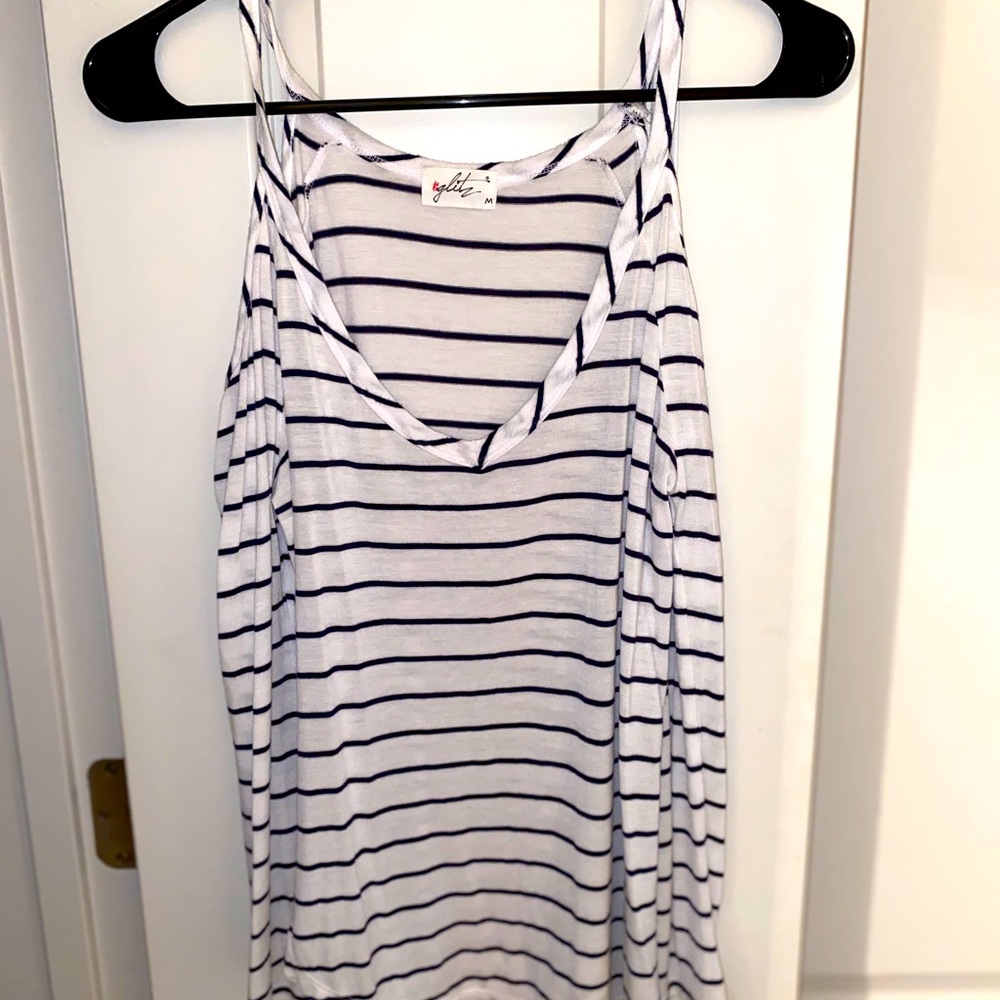 Striped long sleeve with cut our shoulders.